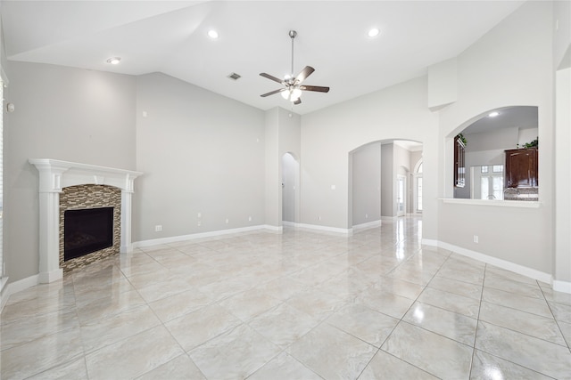 unfurnished living room featuring high vaulted ceiling, ceiling fan, and light tile patterned floors