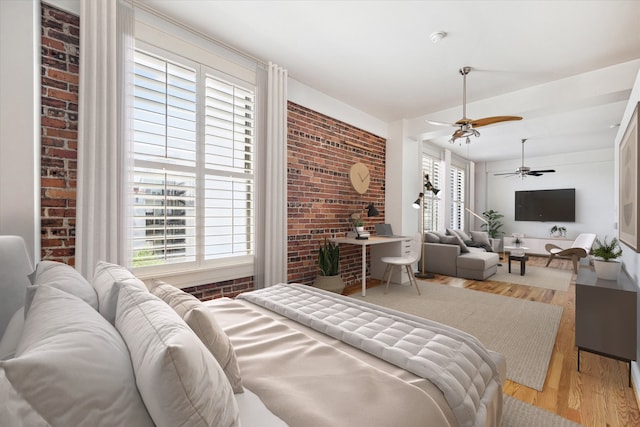 bedroom featuring ceiling fan and light wood-type flooring