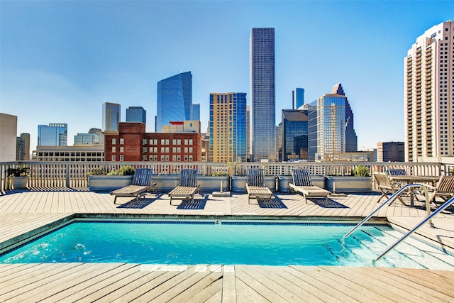 view of pool with a wooden deck