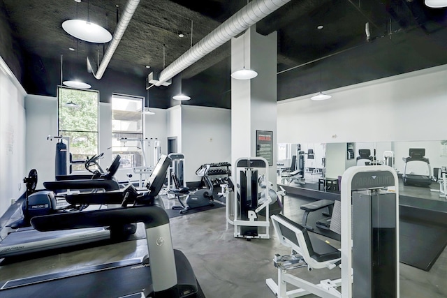 workout area featuring a high ceiling