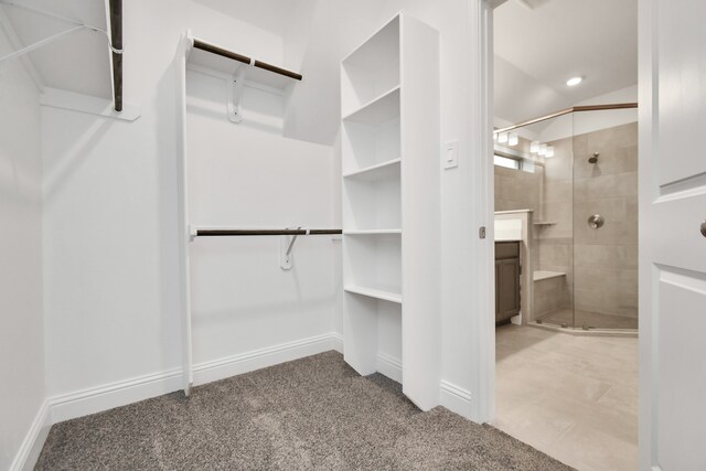 spacious closet with carpet flooring