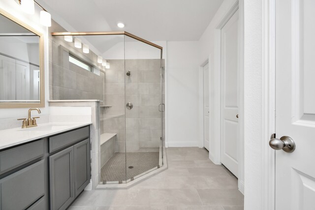 bathroom with vanity and an enclosed shower