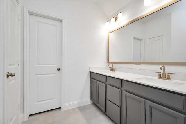 bathroom with tile patterned flooring and vanity