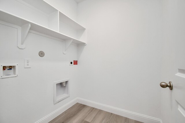 laundry room with hookup for an electric dryer, hookup for a gas dryer, hardwood / wood-style flooring, and hookup for a washing machine