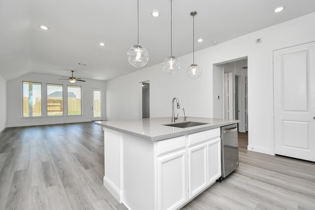 kitchen with sink, decorative light fixtures, a kitchen island with sink, white cabinetry, and dishwasher