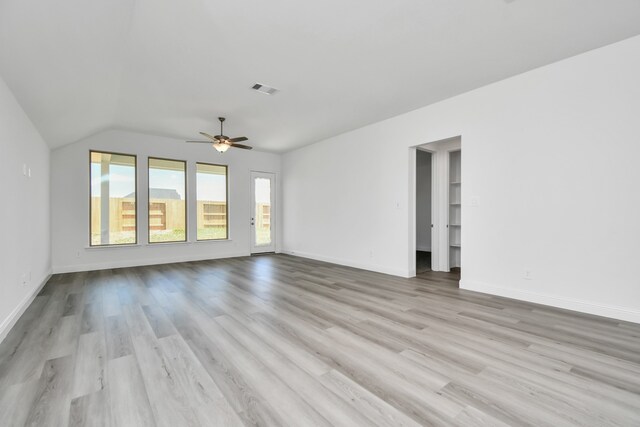 unfurnished living room featuring light hardwood / wood-style flooring, vaulted ceiling, and ceiling fan