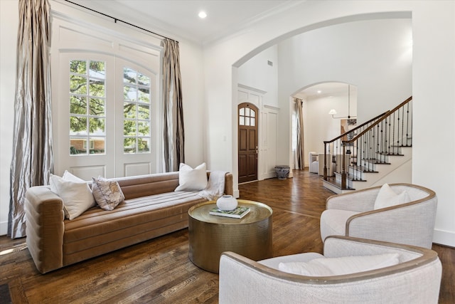 living room with crown molding and dark hardwood / wood-style floors