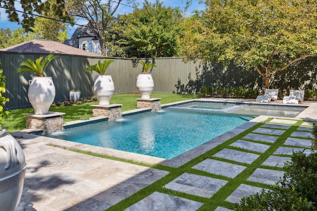 view of swimming pool with an in ground hot tub, a patio area, and pool water feature