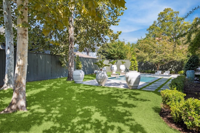 view of yard featuring a fenced in pool