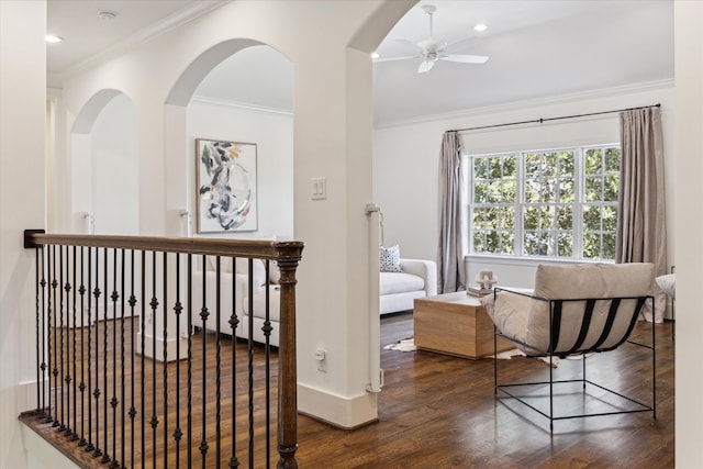 bedroom with ornamental molding, dark wood-type flooring, and ceiling fan