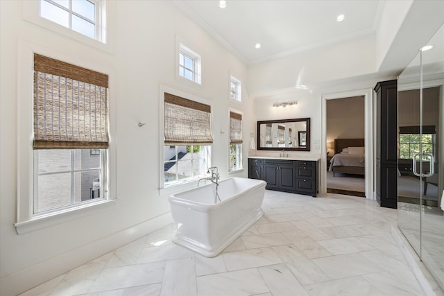 bathroom with vanity, crown molding, independent shower and bath, and a towering ceiling