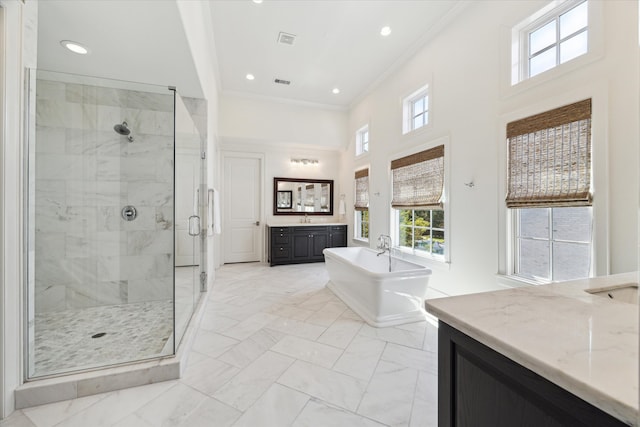 bathroom with vanity, a high ceiling, separate shower and tub, and ornamental molding