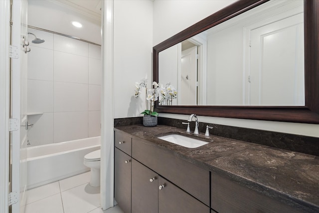 full bathroom with tiled shower / bath, vanity, toilet, and tile patterned flooring