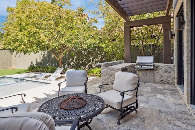 view of patio featuring an outdoor fire pit, area for grilling, and a grill