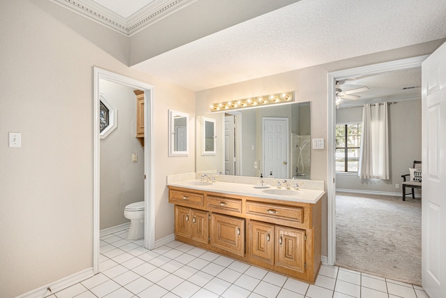 bathroom featuring tile patterned floors, ceiling fan, toilet, and a textured ceiling