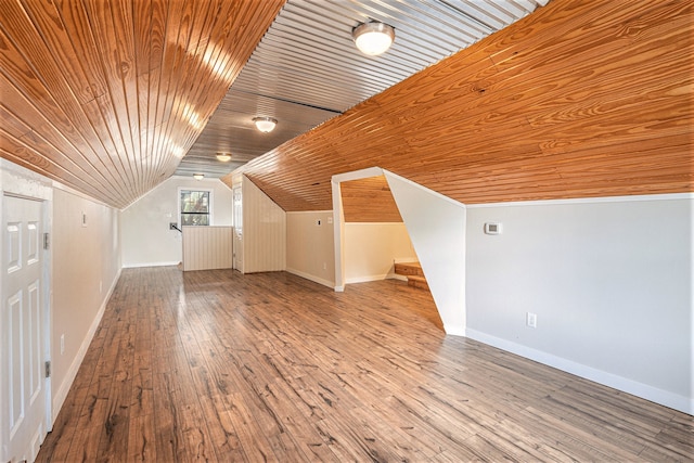 additional living space featuring wood ceiling, lofted ceiling, and hardwood / wood-style flooring