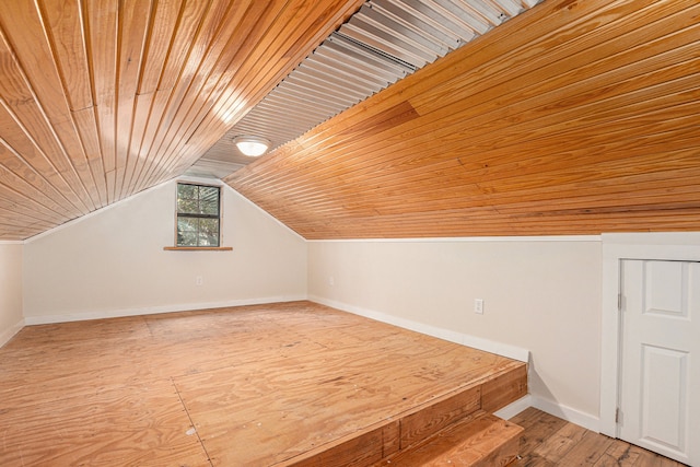 bonus room featuring light hardwood / wood-style floors, wood ceiling, and vaulted ceiling