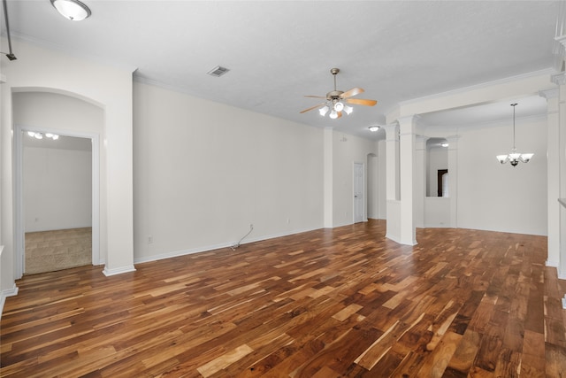 unfurnished living room featuring ceiling fan with notable chandelier, dark hardwood / wood-style floors, and ornamental molding