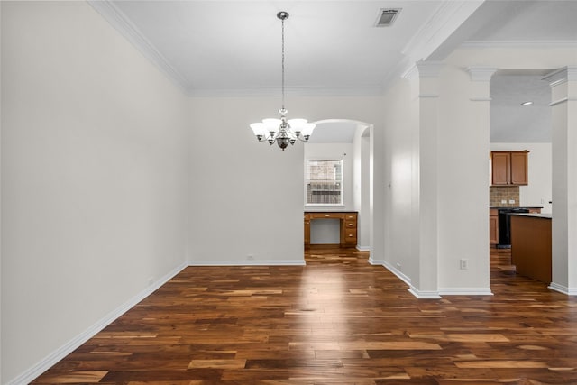 unfurnished dining area featuring a chandelier, dark hardwood / wood-style floors, and ornamental molding