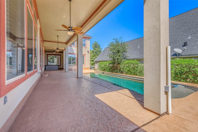 view of pool featuring ceiling fan and a patio area