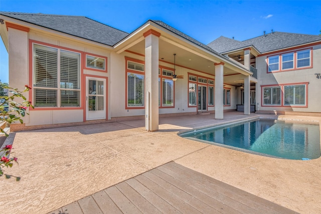 view of pool with ceiling fan and a patio area