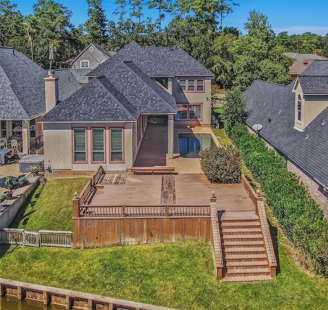 back of house featuring a yard and a patio area