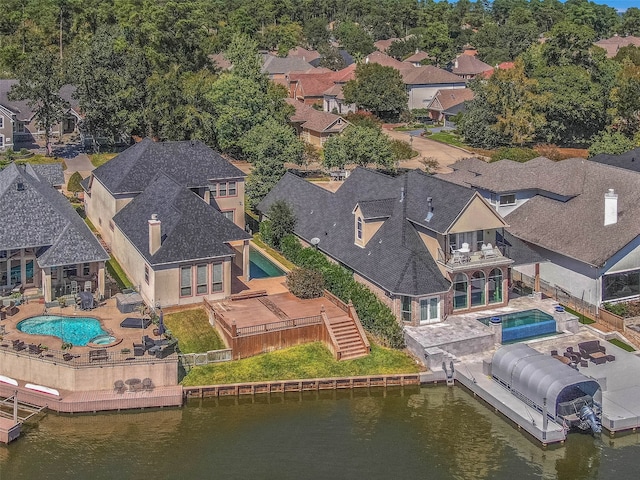 birds eye view of property featuring a water view