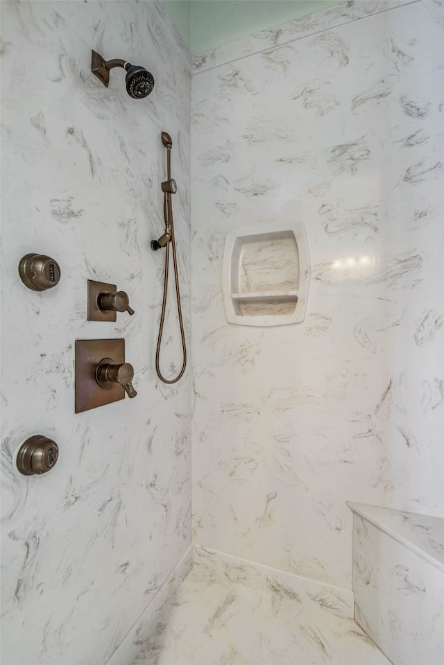 bathroom with tiled shower