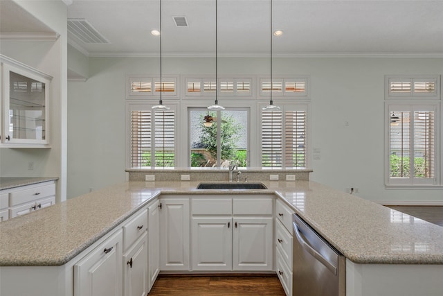 kitchen with a wealth of natural light, white cabinetry, dishwasher, and sink