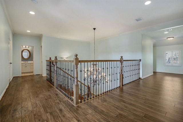 hallway featuring crown molding and dark hardwood / wood-style floors