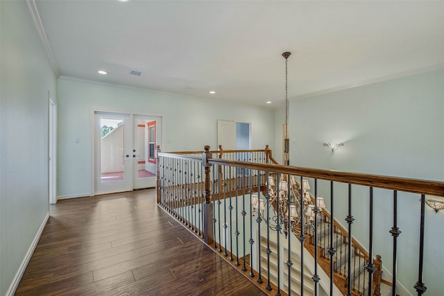 hall with ornamental molding, dark hardwood / wood-style flooring, and french doors