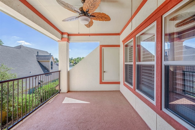 view of patio / terrace with ceiling fan and a balcony