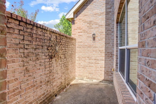 view of side of home featuring a patio