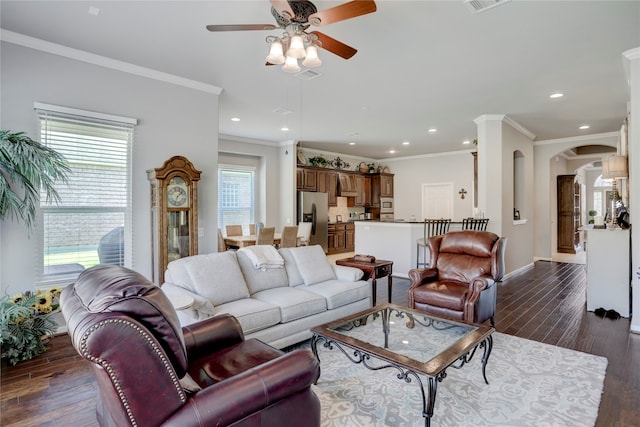 living room featuring ornamental molding, ceiling fan, and dark hardwood / wood-style flooring