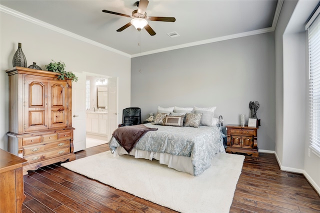 bedroom with crown molding, ensuite bathroom, dark wood-type flooring, and ceiling fan