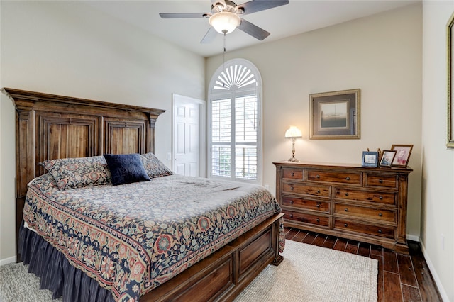 bedroom with ceiling fan and dark hardwood / wood-style flooring