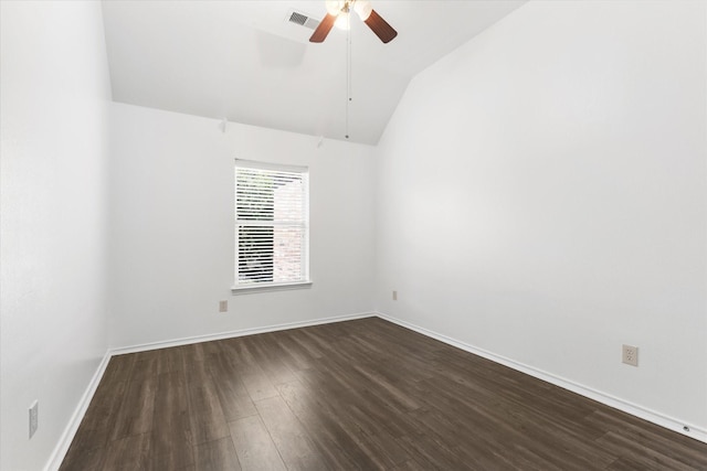 spare room featuring ceiling fan, vaulted ceiling, and dark wood-type flooring