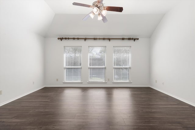 spare room with ceiling fan, dark wood-type flooring, and lofted ceiling