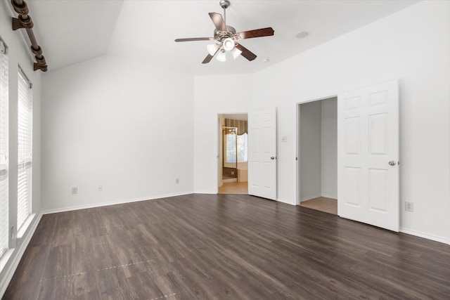 unfurnished room with ceiling fan, dark hardwood / wood-style flooring, and lofted ceiling