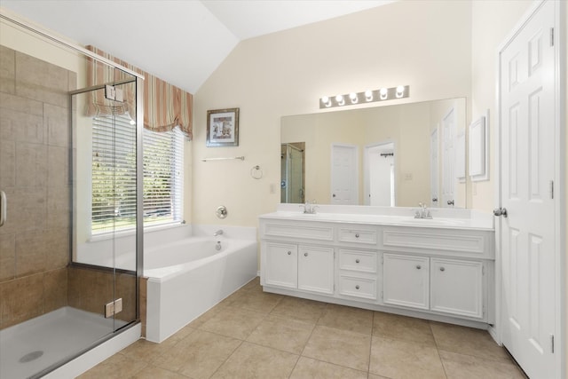 bathroom with tile patterned floors, vanity, lofted ceiling, and independent shower and bath