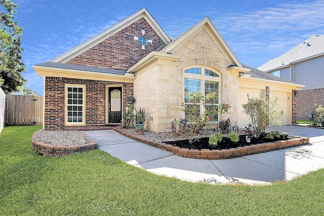 view of front of property featuring a garage and a front yard