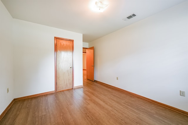 unfurnished room featuring light wood-type flooring