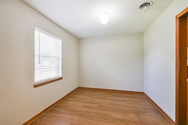 unfurnished room featuring light hardwood / wood-style floors