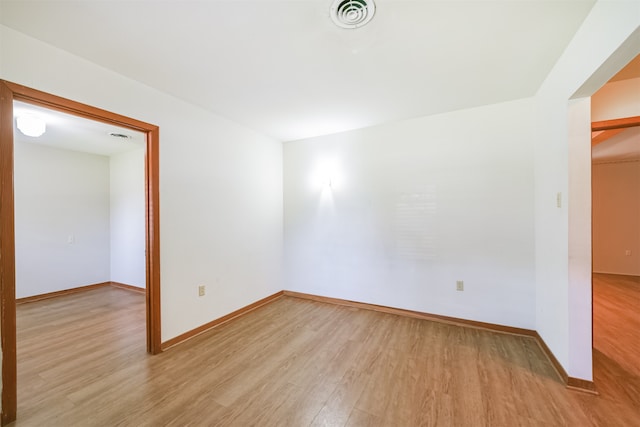 unfurnished room featuring light hardwood / wood-style flooring