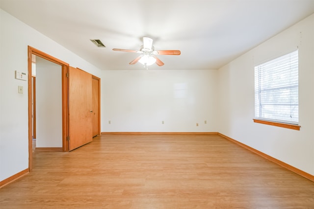 unfurnished room with ceiling fan and light hardwood / wood-style flooring