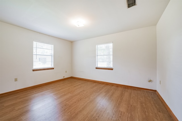 spare room featuring hardwood / wood-style flooring