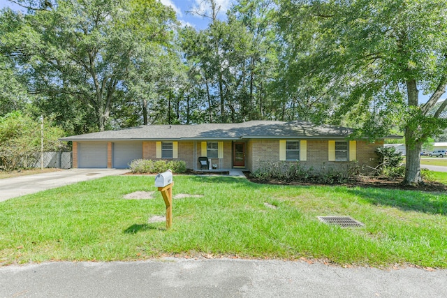 single story home featuring a garage and a front yard