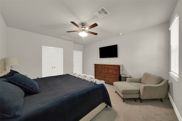 carpeted bedroom with ceiling fan