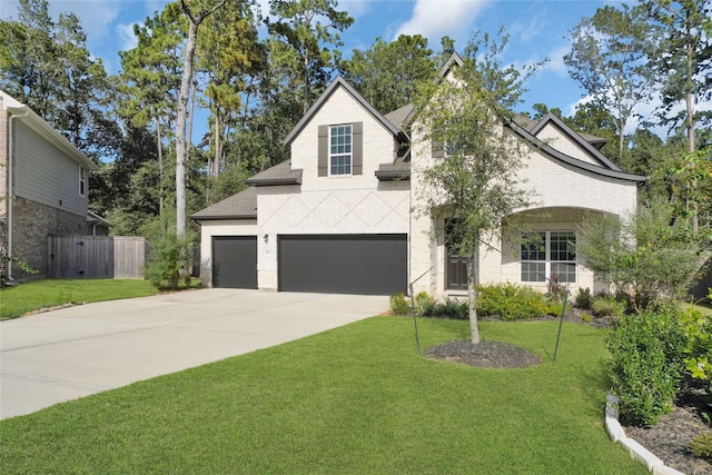 view of front property featuring a front yard and a garage