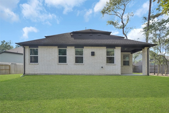 back of house featuring a yard